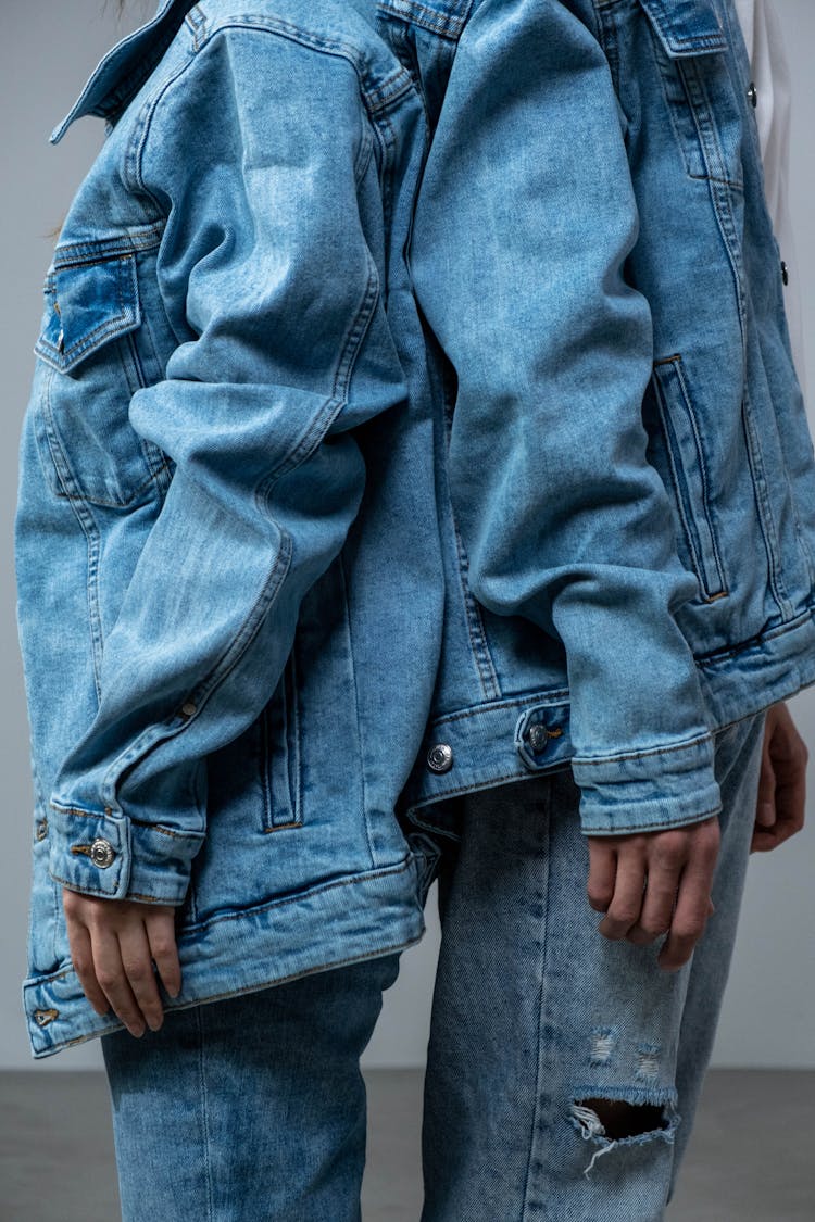 Two People In Blue Denim Jacket