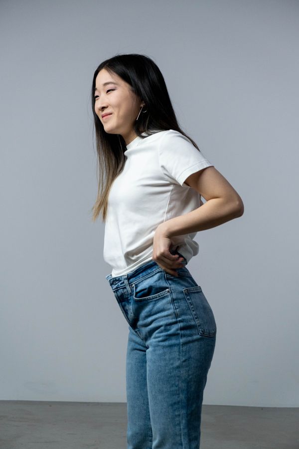 Woman in straight-leg jeans and white t-shirt