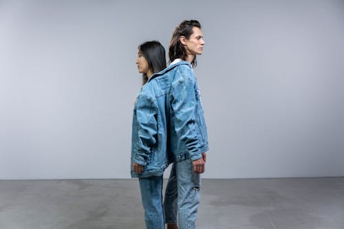 A Man and Woman in Denim Jackets and Pants
