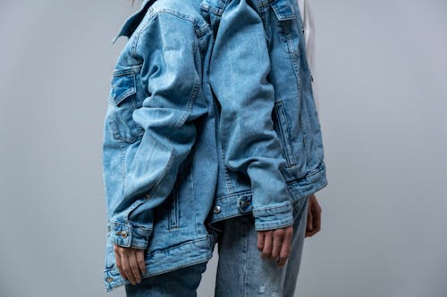 Two People Wearing a Denim Jacket