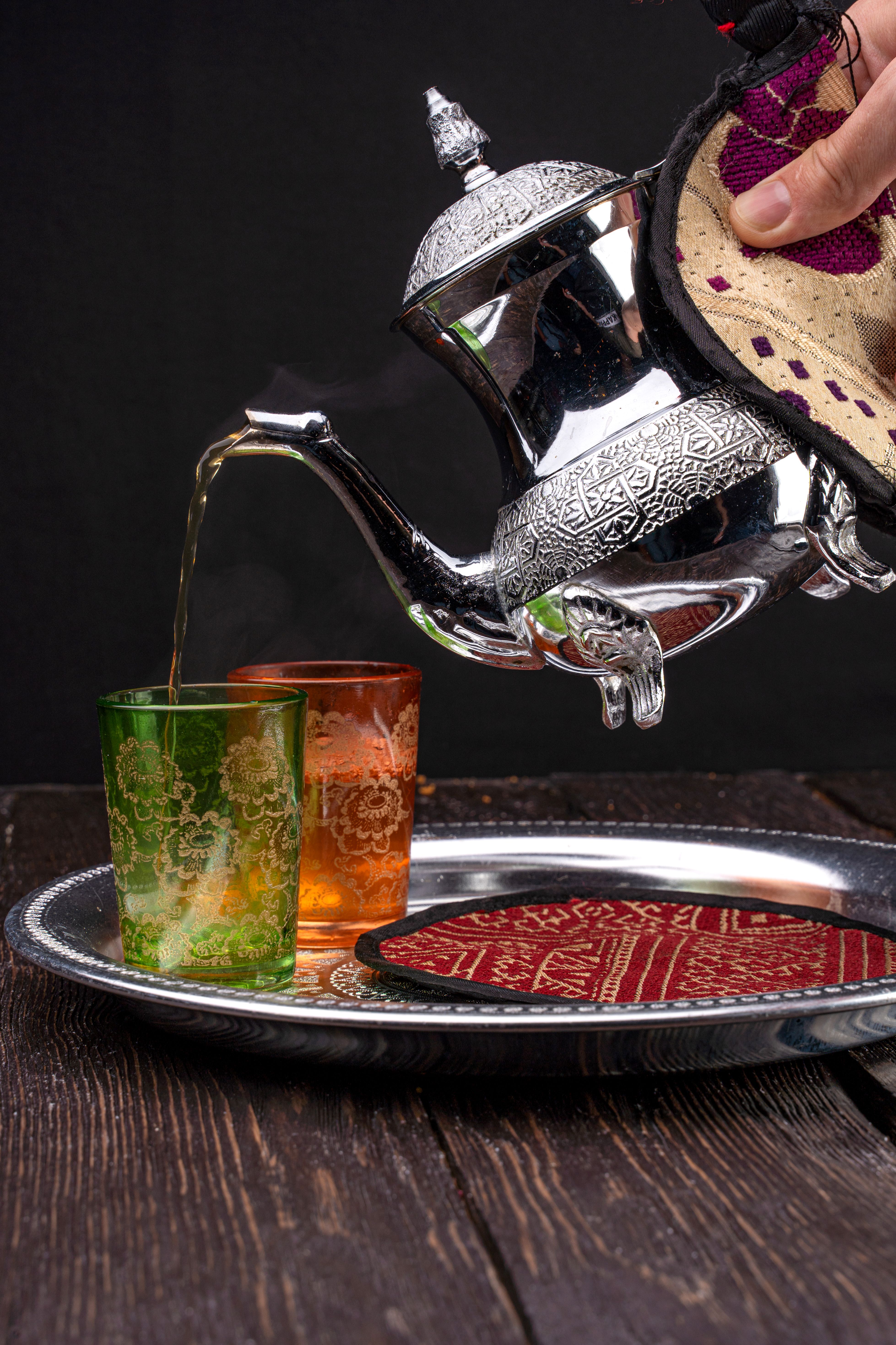 Moroccan mint tea being poured from height