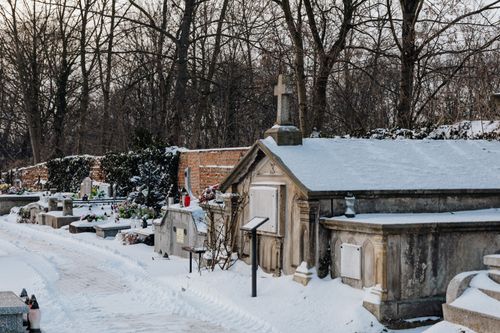 Free A serene cemetery blanketed in snow, creating a peaceful winter scene. Stock Photo