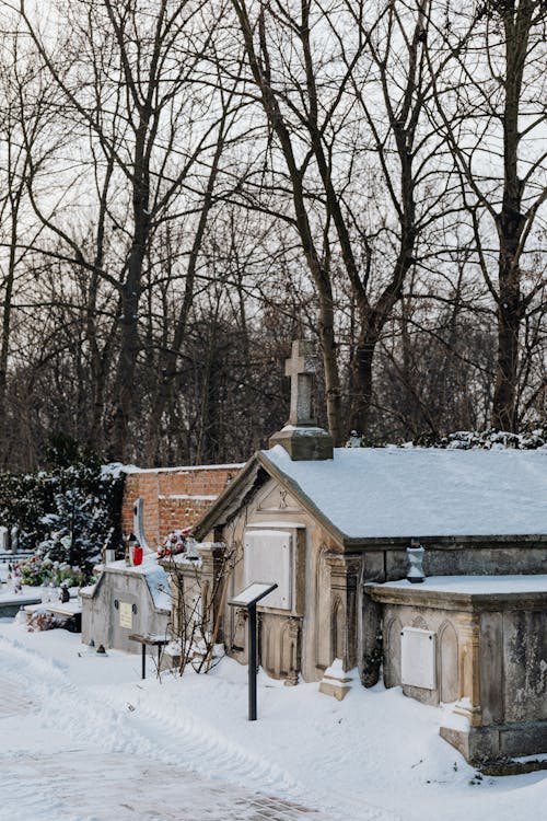 A Row of Grave Houses on Snow Covered Ground