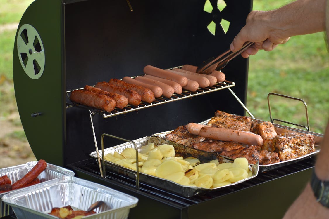 Free Hotdogs in the Griller Stock Photo