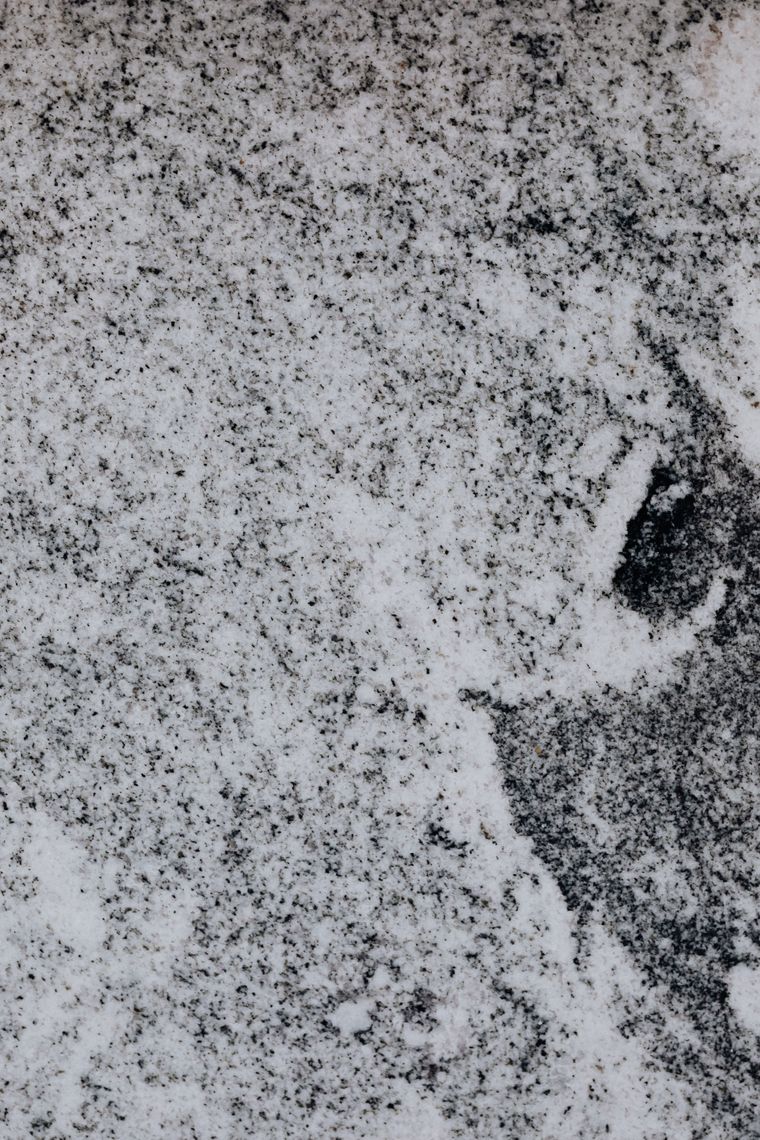 Large-format porcelain floor slab with a white and black marble effect
