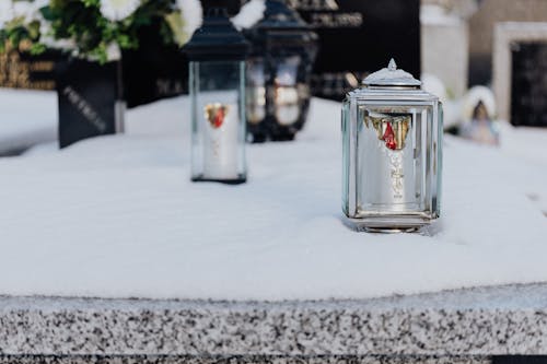  Clear Glass Candle Holders on Snow Covered Tomb