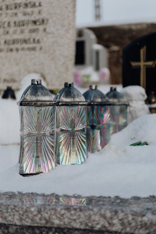 Free Lanterns on Top of a Snow Covered Tomb Stock Photo