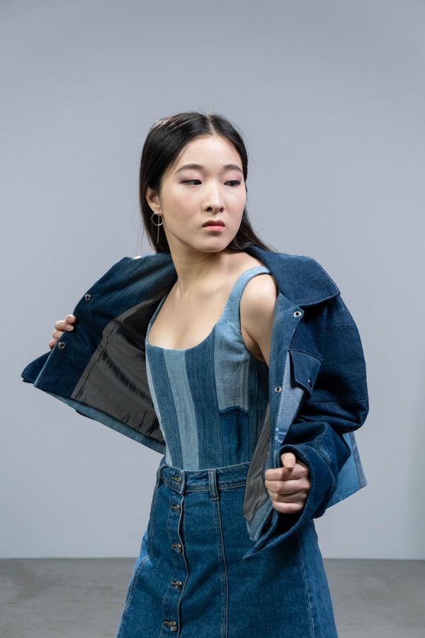 Denim pinafore over striped top