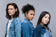 Man and Two Women in Denim Jackets Posing