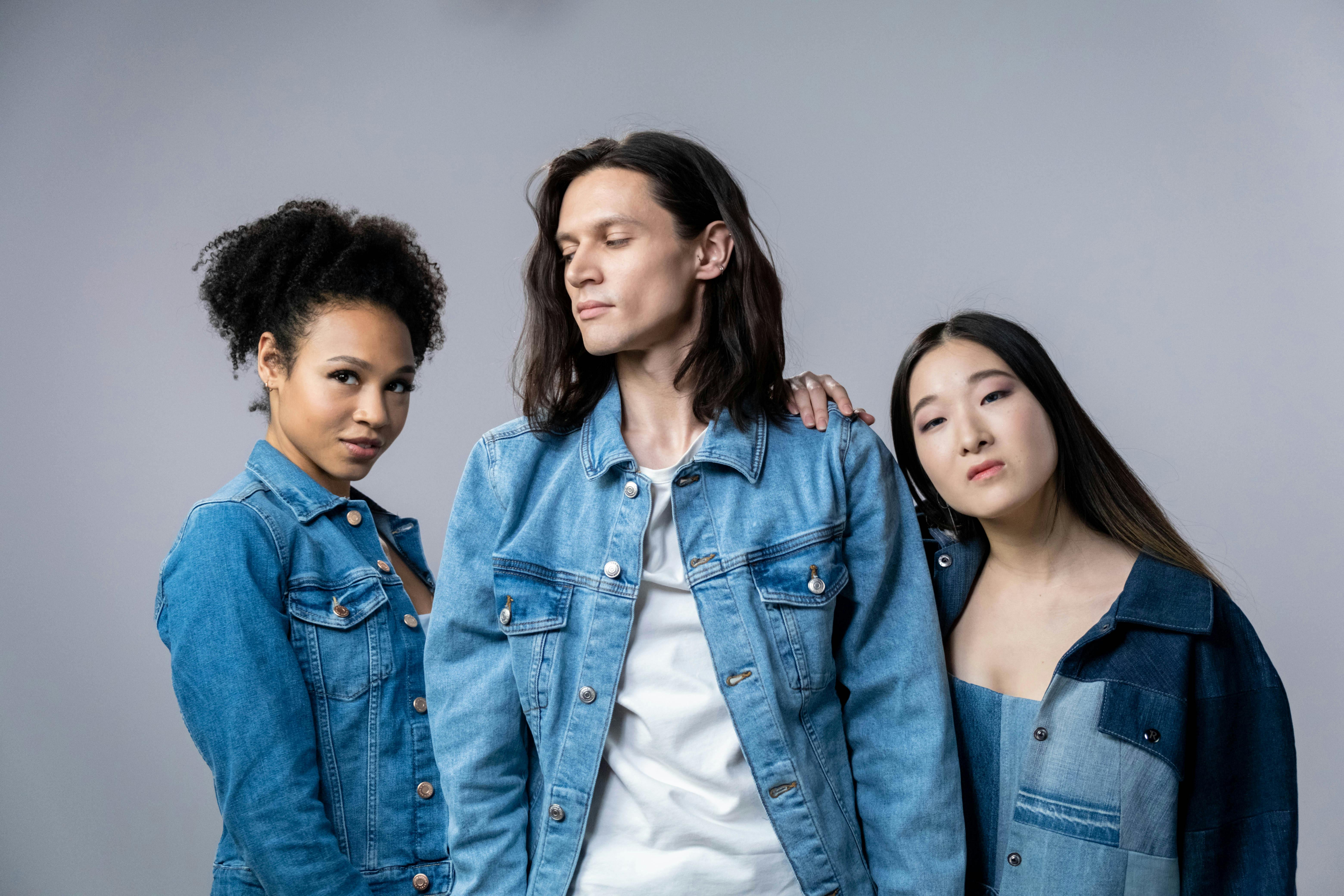 people in denim clothes posing together