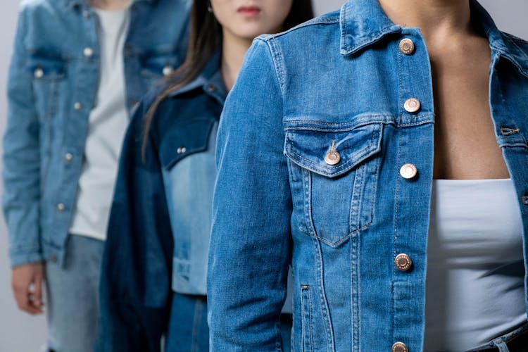 A Group Of People Wearing Denim Jackets