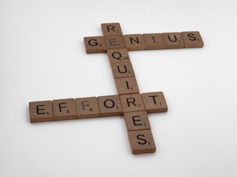 Scrabble Pieces on White Surface