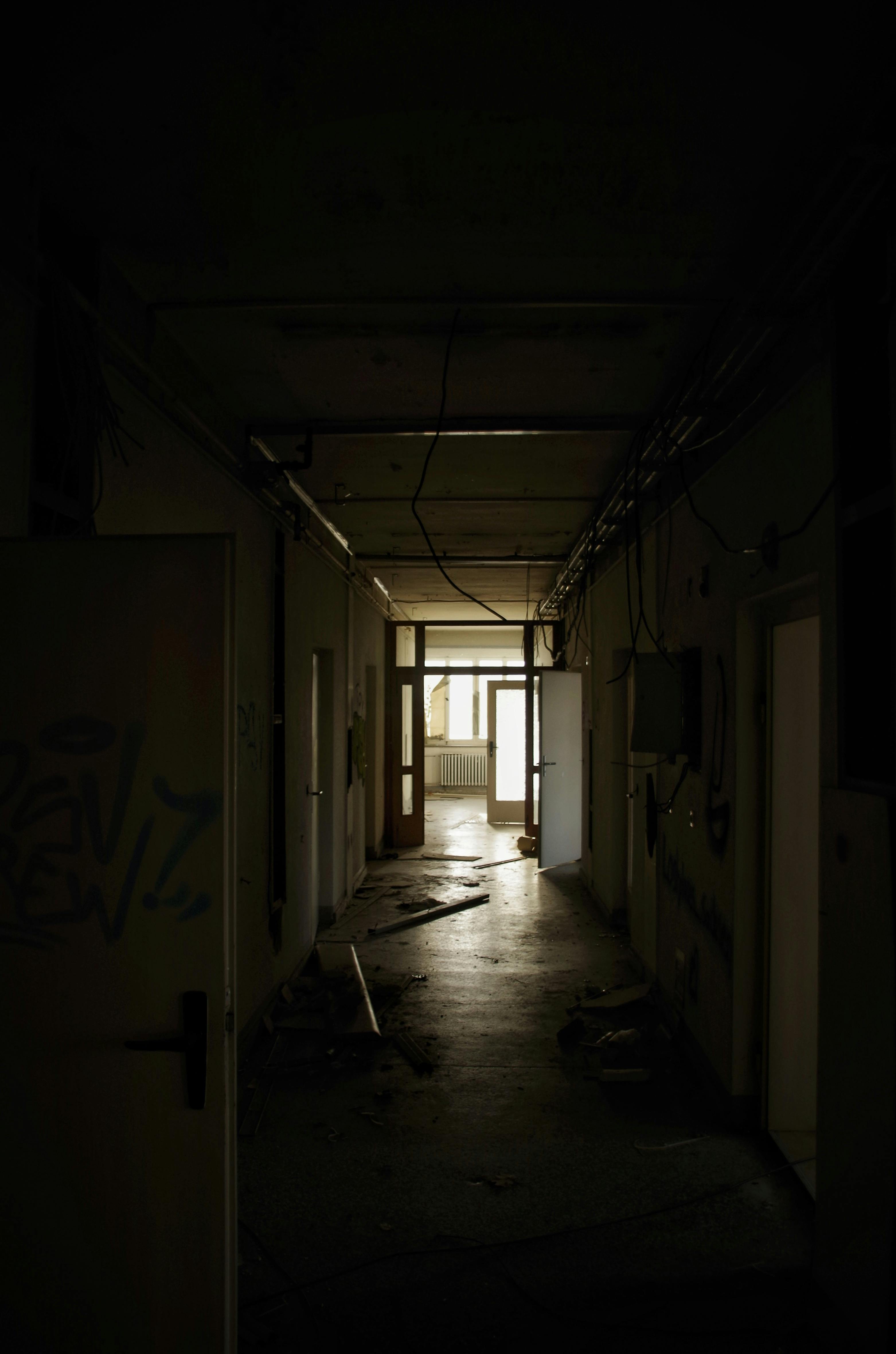 abandoned building with dark hallway