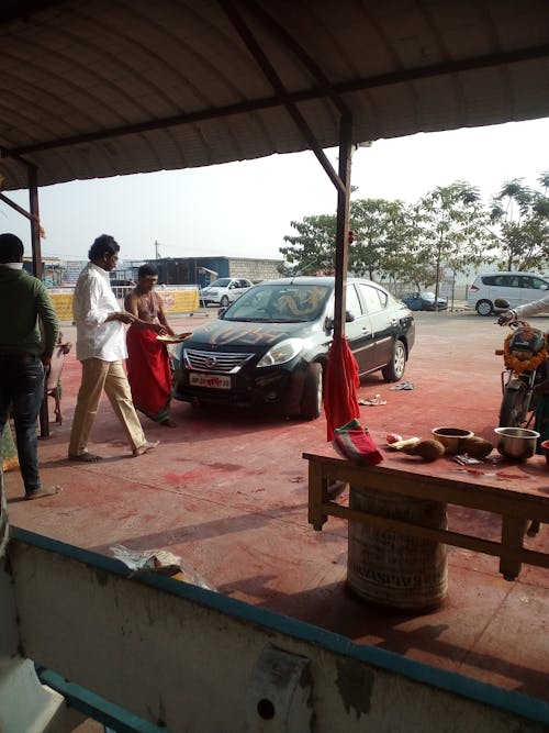 Free stock photo of performing pooja for new car Stock Photo
