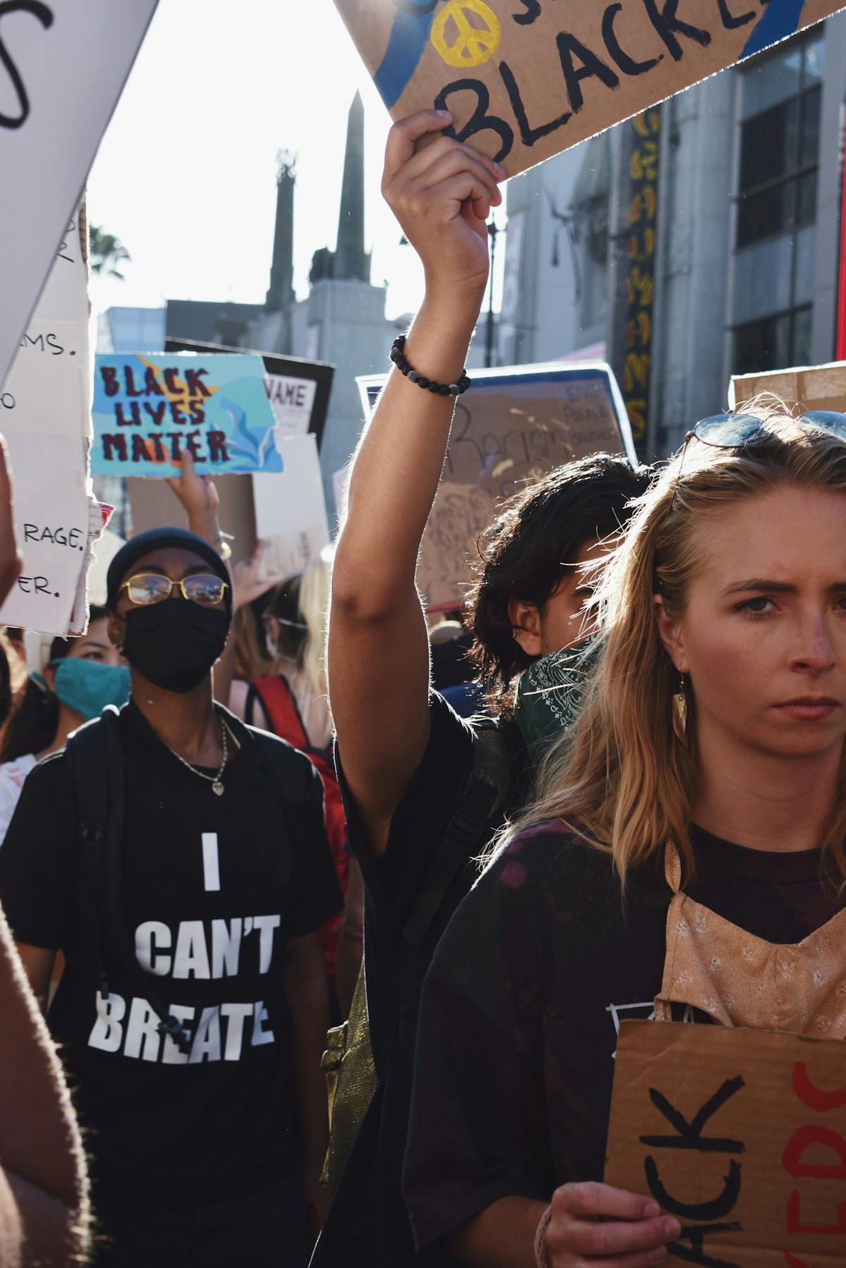 Charts and graphs on paper and a laptop representing tokenomics and data analysis