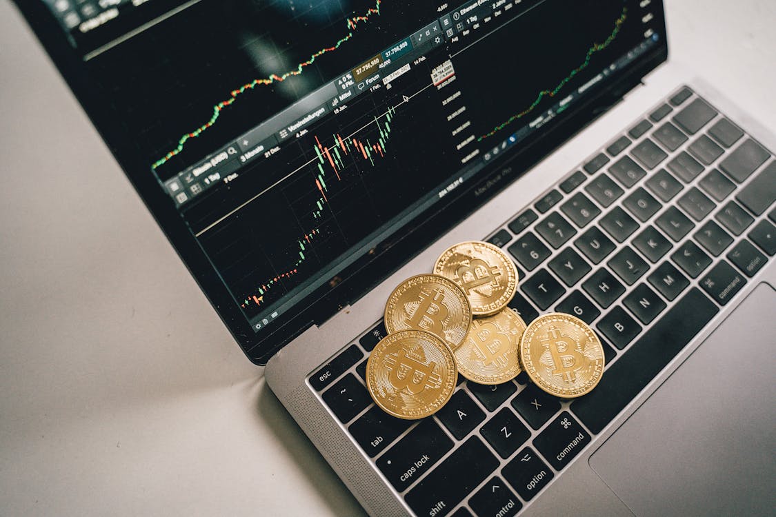Free Coins On Top of a Laptop Stock Photo