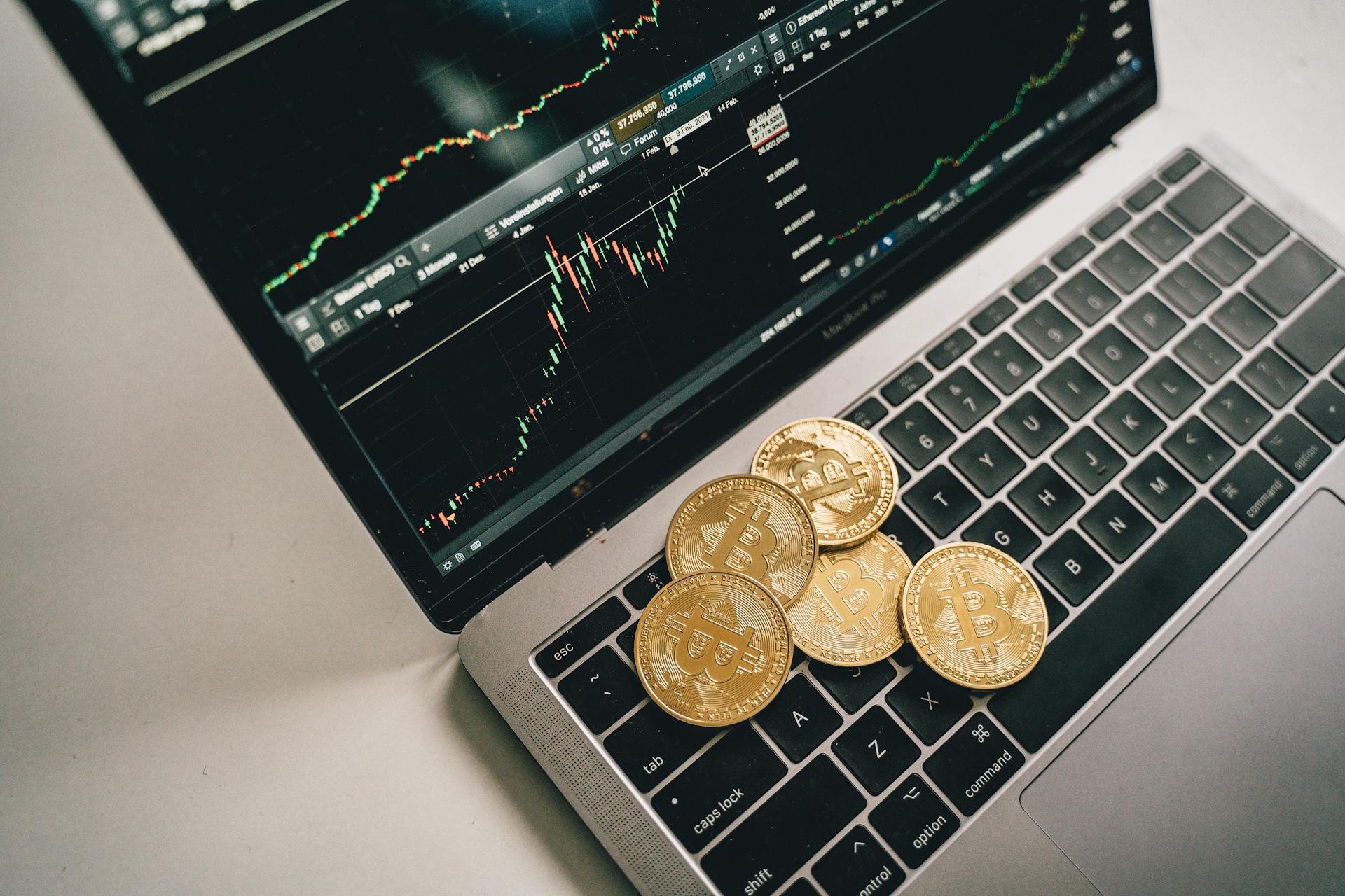 Coins On Top of a Laptop