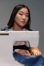 A Woman Sewing