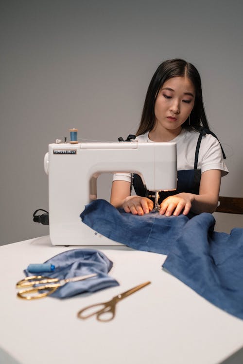 Woman Using a Sewing Machine