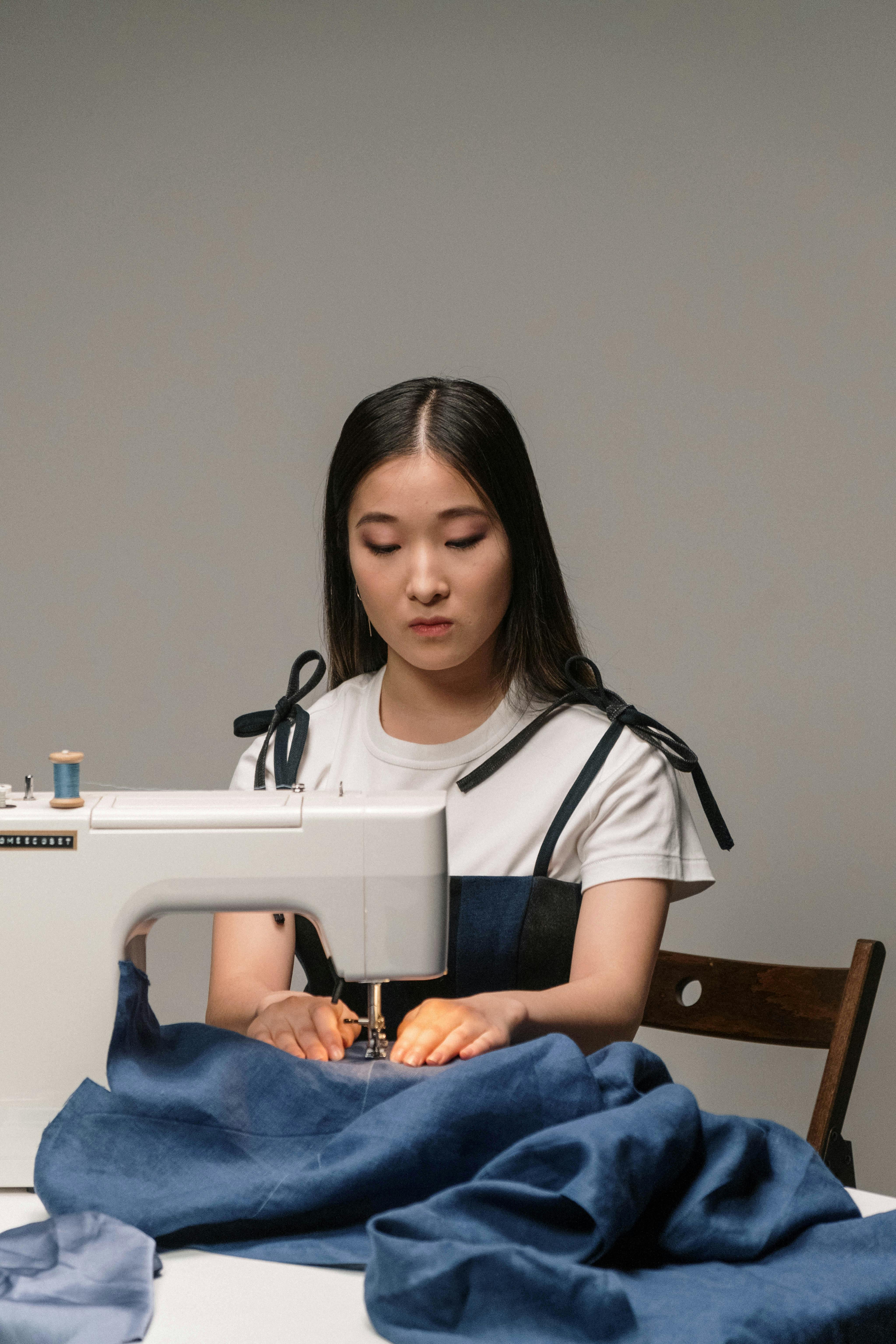 woman sewing using a denim fabric