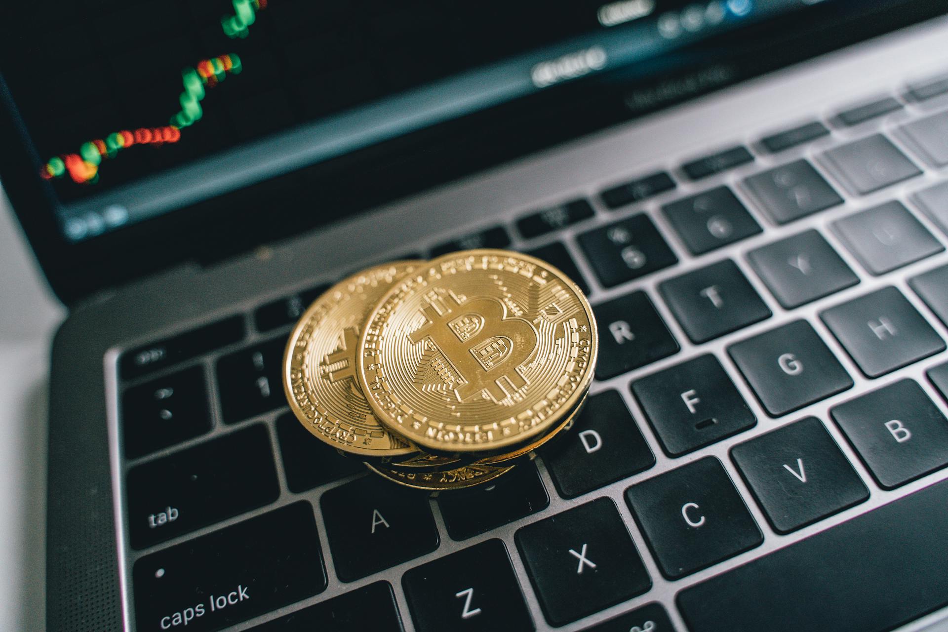 A Stack of Bitcoins on a Laptop Keyboard