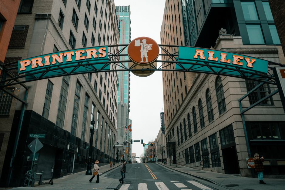 Vibrant view of Printer's Alley in Nashville, showcasing urban architecture and city life.