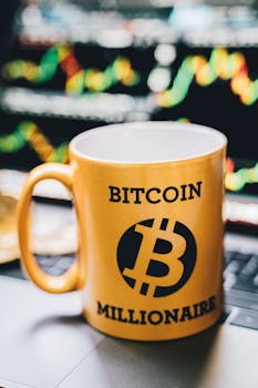 Close-up of a 'Bitcoin Millionaire' mug in front of a vibrant stock chart background.