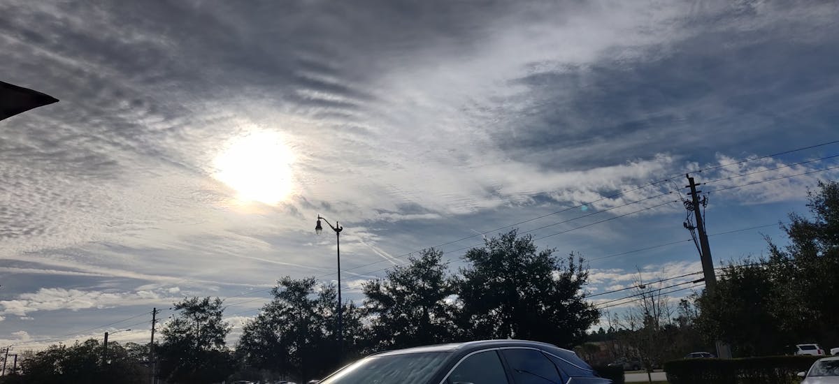 Digital coin overlaid on candlestick chart representing stablecoin trading