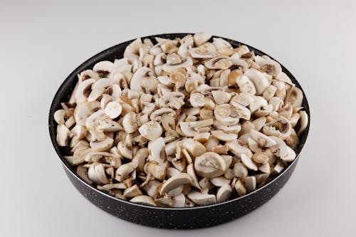 Free Close-Up Shot of Slices of Mushroom in a Bowl Stock Photo