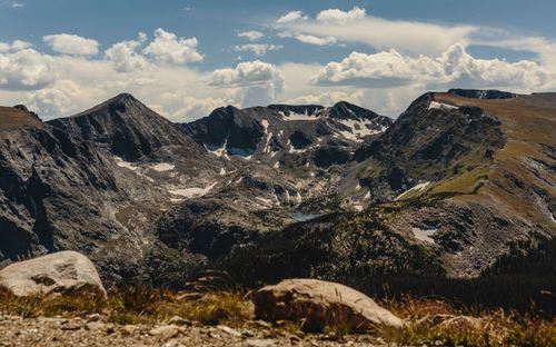 Free Breathtaking view of the Rocky Mountains with a scenic cloudy sky in Colorado during summer. Stock Photo