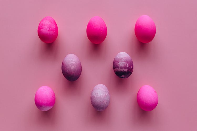 Colored Eggs On Pink Background 