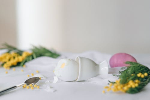 Free Broken Egg on an Egg Cup Stock Photo