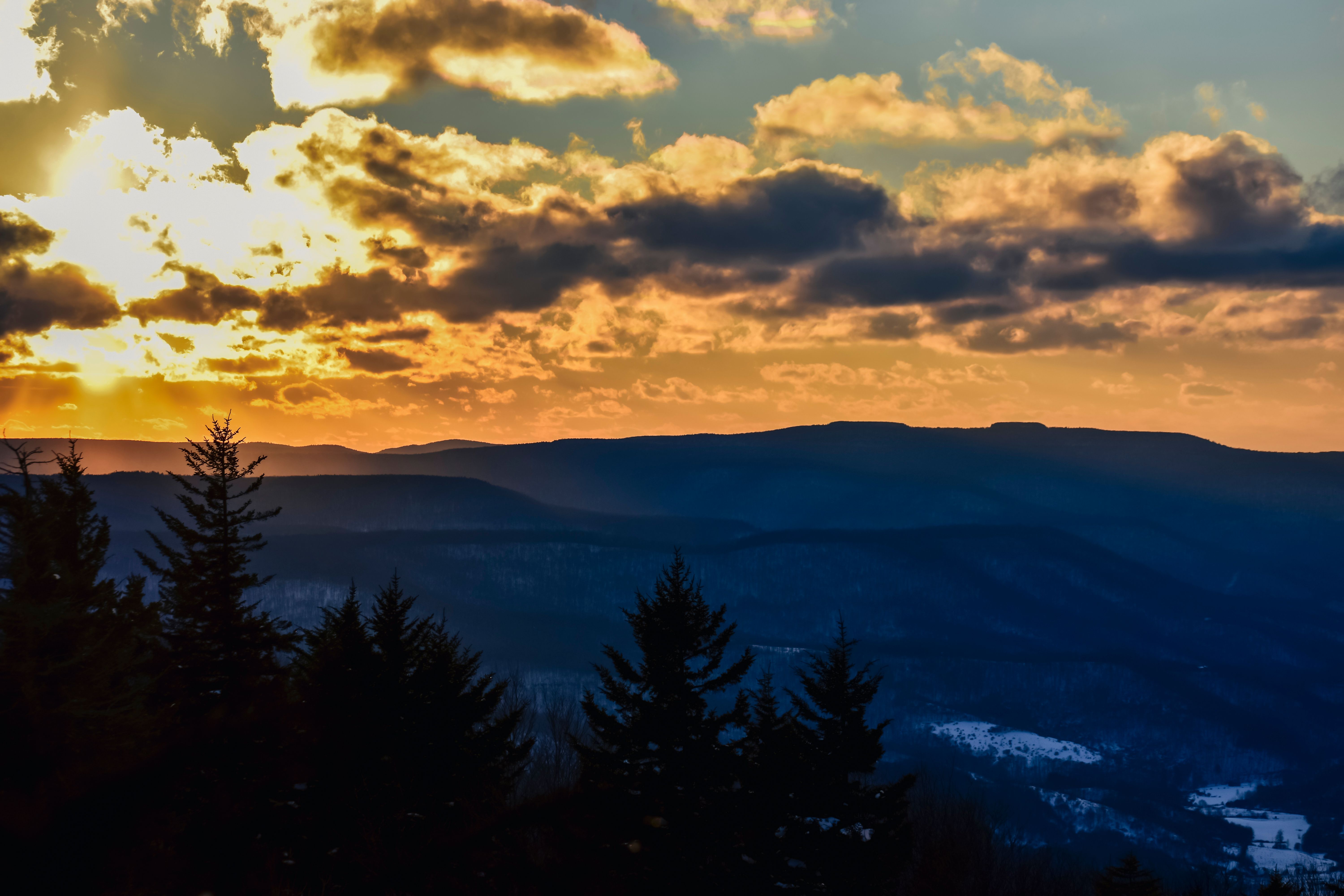 A Snow Covered Mountain during the Golden Hour · Free Stock Photo