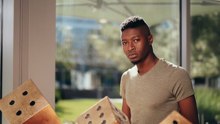 A Man In V Neck Brown Shirt