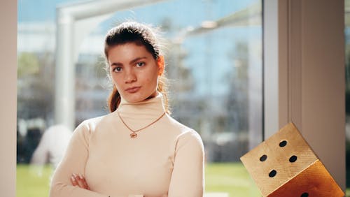 A Woman in White Turtleneck Long Sleeve Shirt