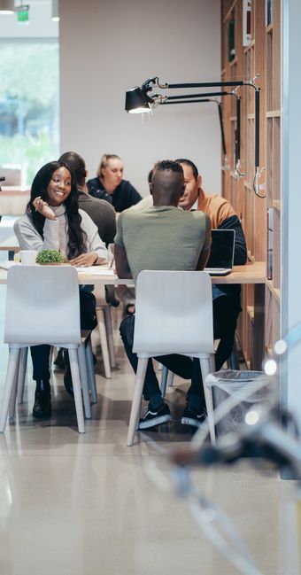 A team working in a bright open office — photo by Kindel Media on Pexels