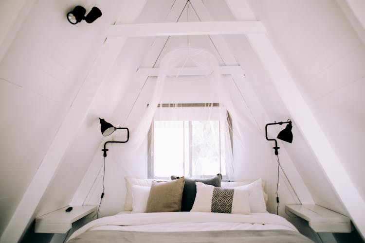 Pillows On A Bed In A Bedroom In The Attic