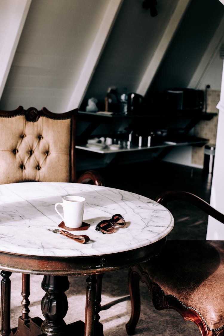 Coffee And Sunglasses On A Marble Table 