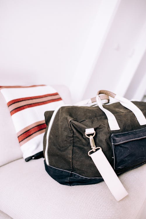 Free Black and White Bag on the Couch Stock Photo