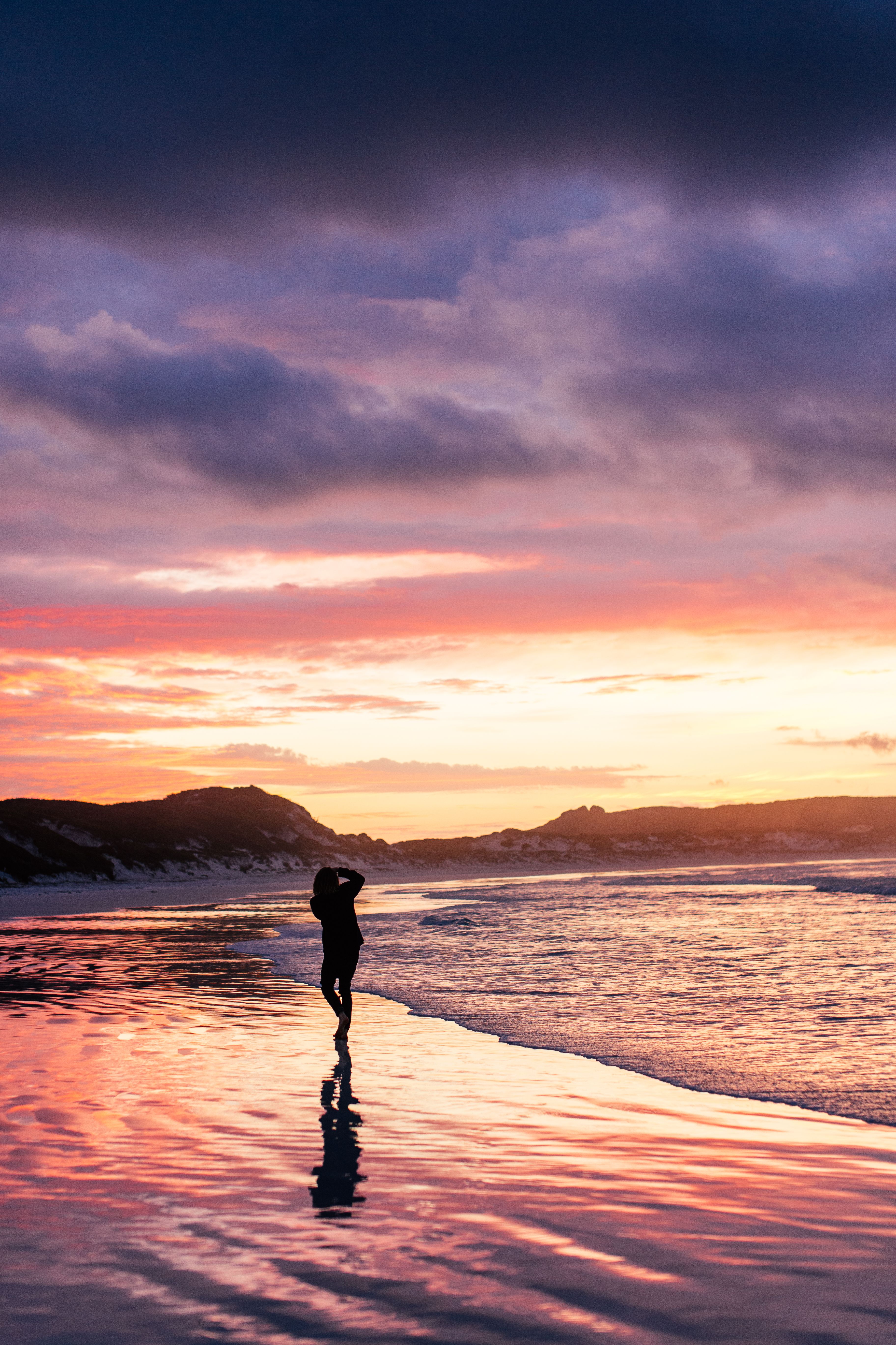 Silhouette of Person Standing on the Beach · Free Stock Photo