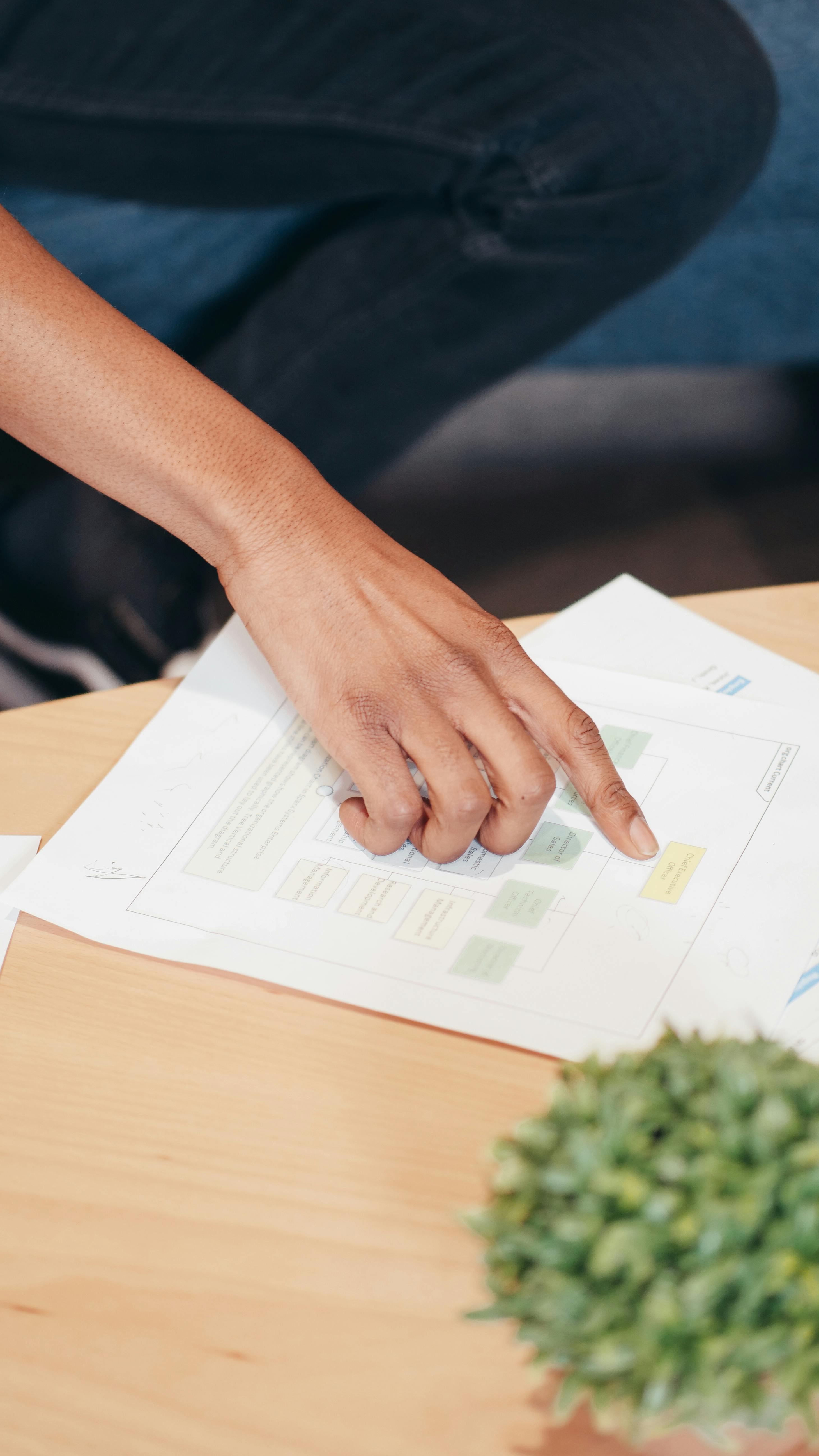 person holding white printer paper