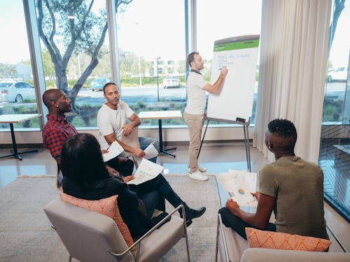 Free Office Team Having Discussion in the Room Stock Photo