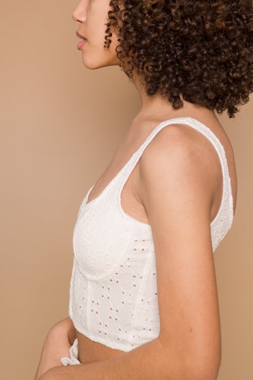 Crop ethnic woman in white clothes