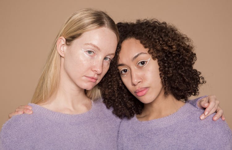 Serious Diverse Girlfriends With Graphic Eyeliner