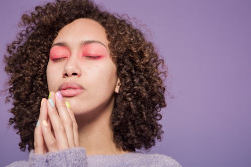 Ethnic woman with curly hair dreaming