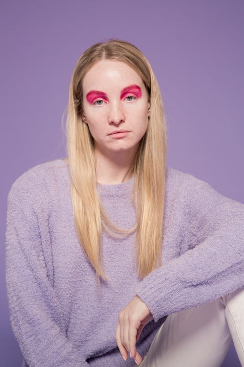 Woman with fair hair and pink eyeshadows