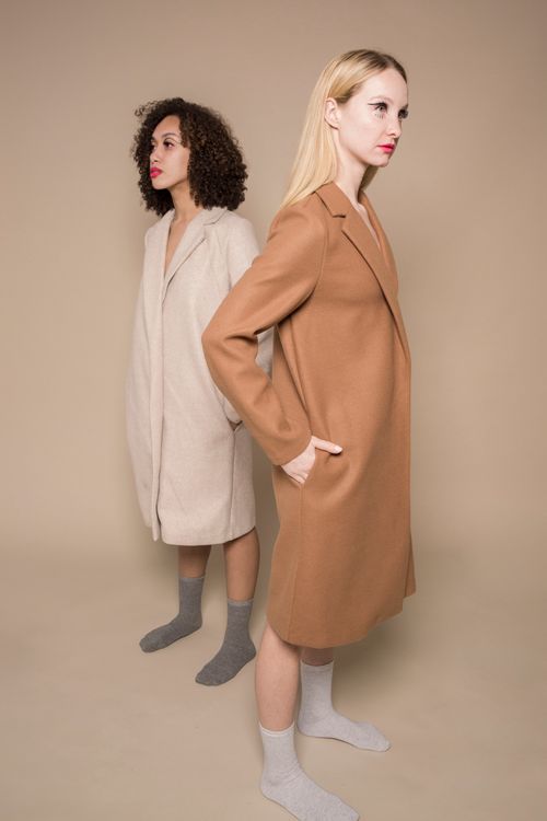 Free Full body of multiethnic young trendy friends conflicting and looking away on beige background Stock Photo