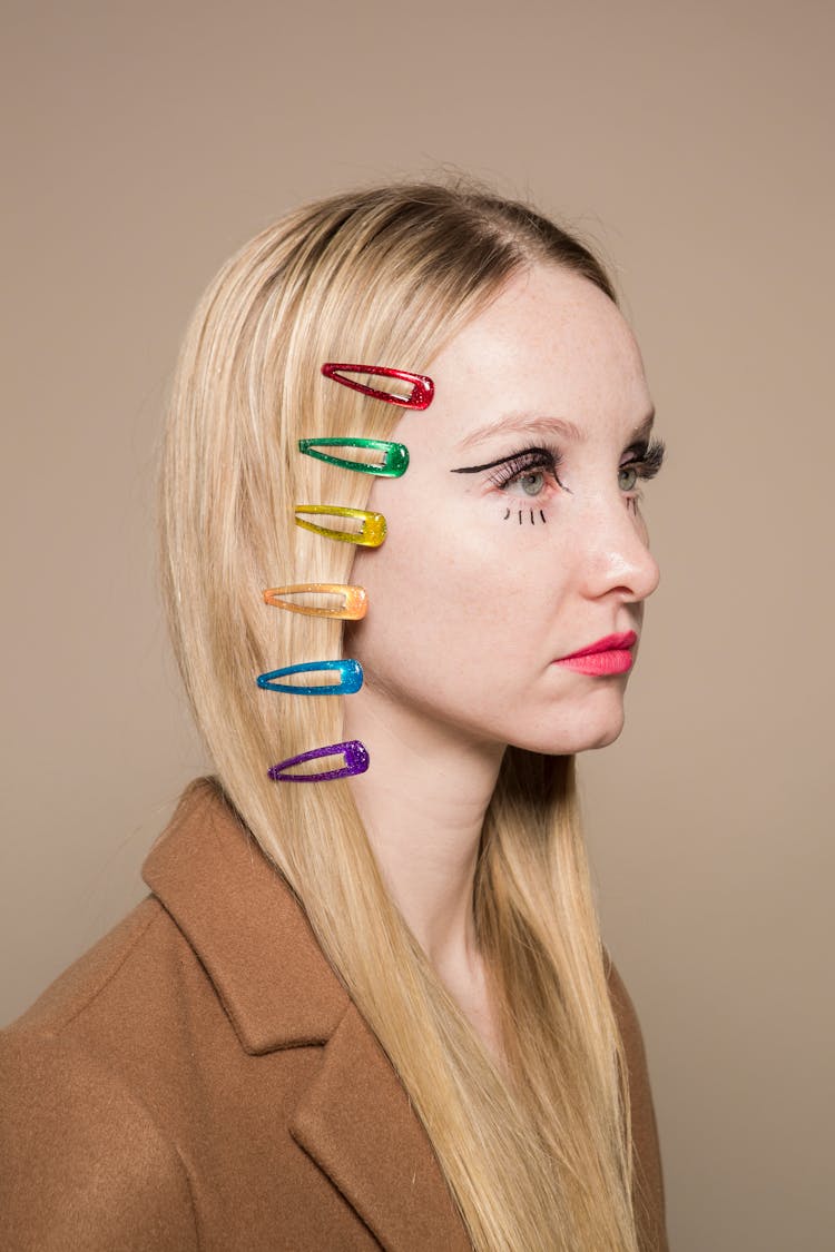 Woman With Many Multicolored Hair Clips