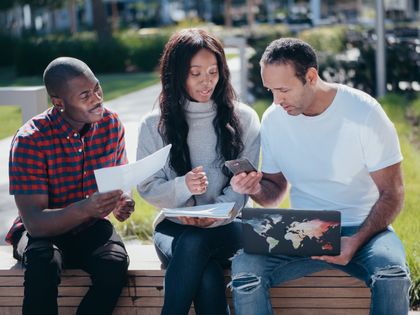 Team meeting outdoors in a park — photo by Kindel Media on Pexels