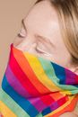 Stylish woman with headscarf covering face